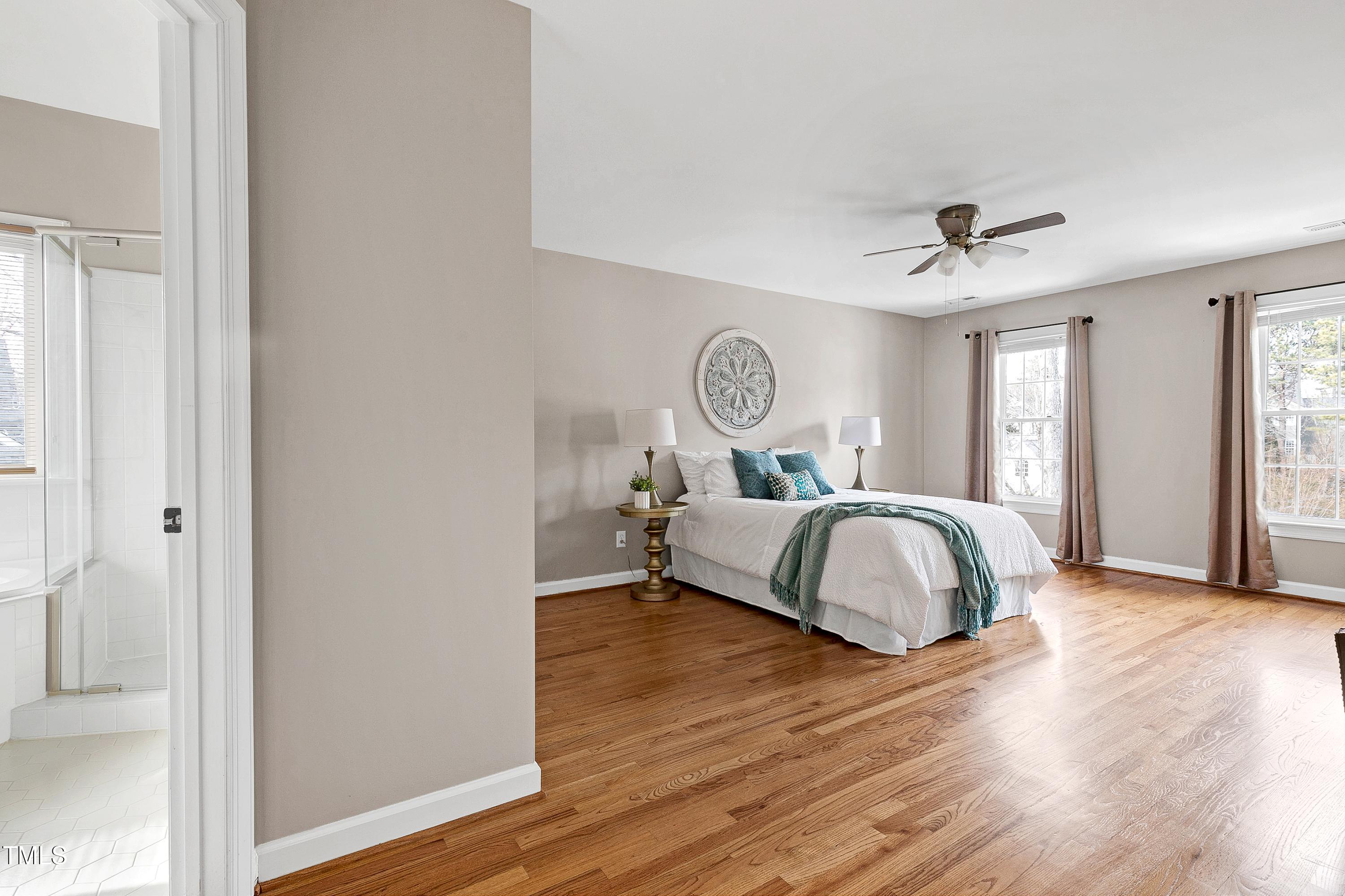103 Sandy Hook Way Cary, NC 27513 - Photo 22 of 45 a bedroom with a bed and wooden floor