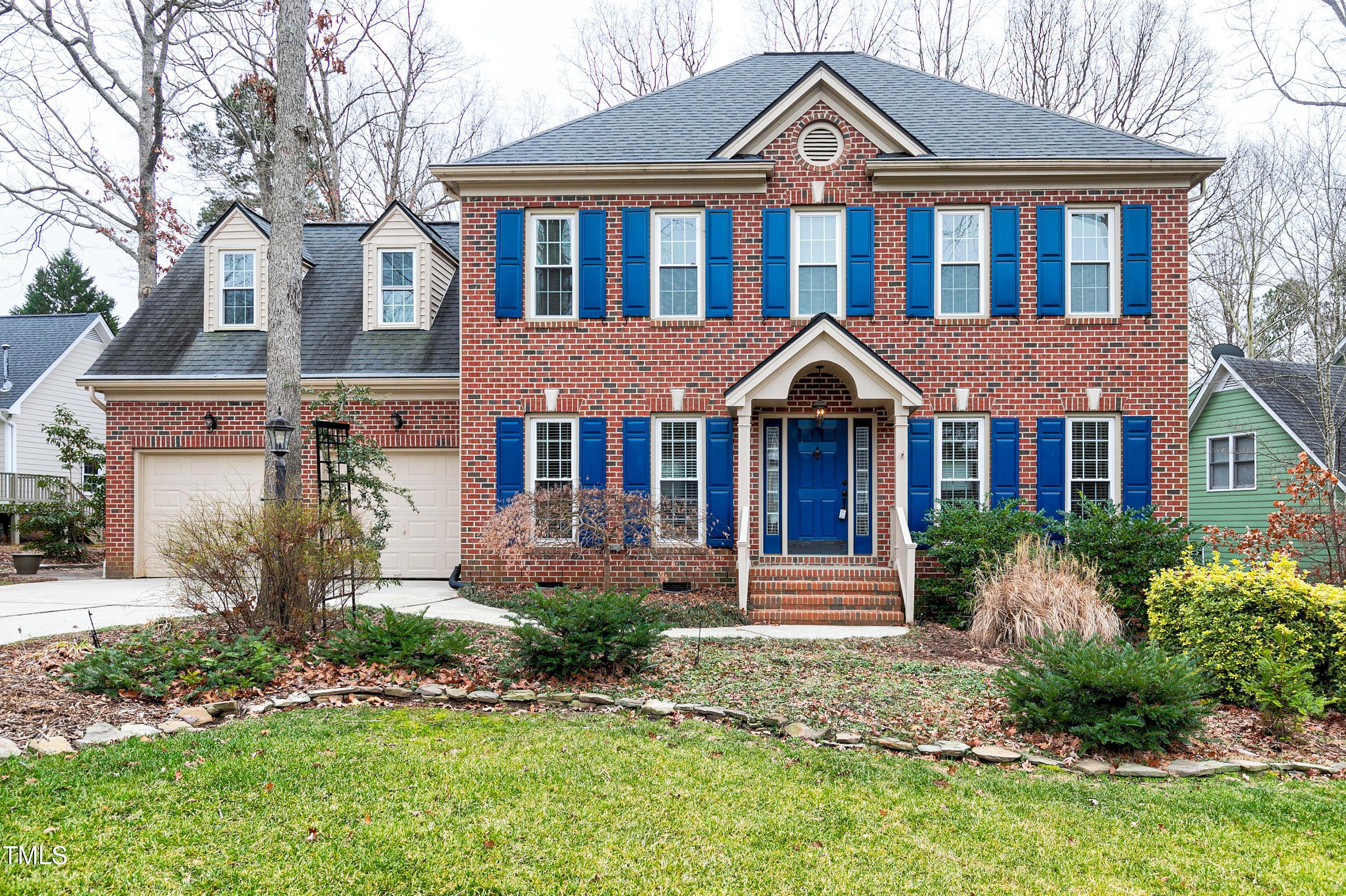 103 Sandy Hook Way Cary, NC 27513 - Photo 3 of 45 a front view of a house with yard and green space