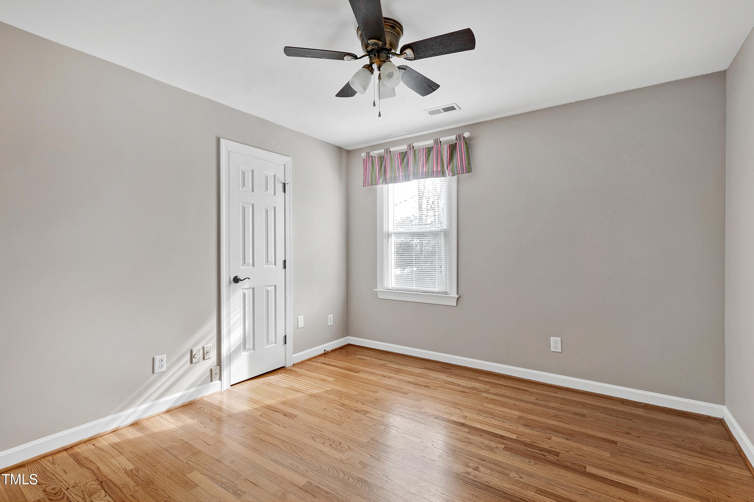103 Sandy Hook Way Cary, NC 27513 - Photo 31 of 45 wooden floor in an empty room with a window