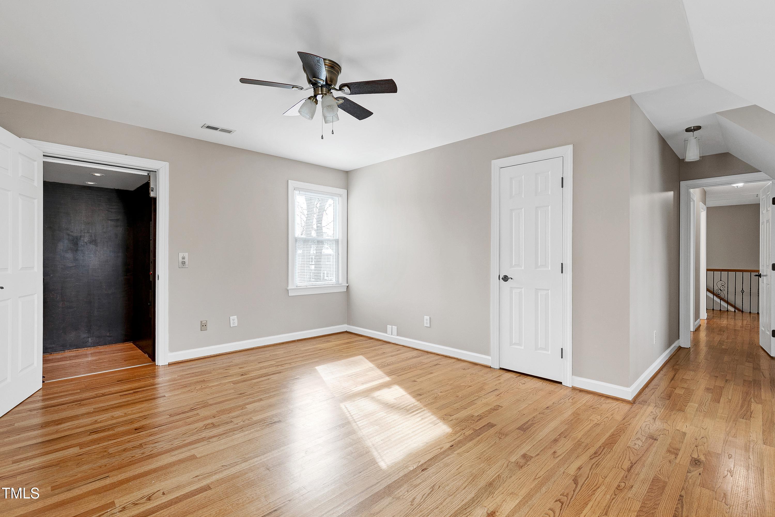 103 Sandy Hook Way Cary, NC 27513 - Photo 36 of 45 wooden floor in an empty room with a window