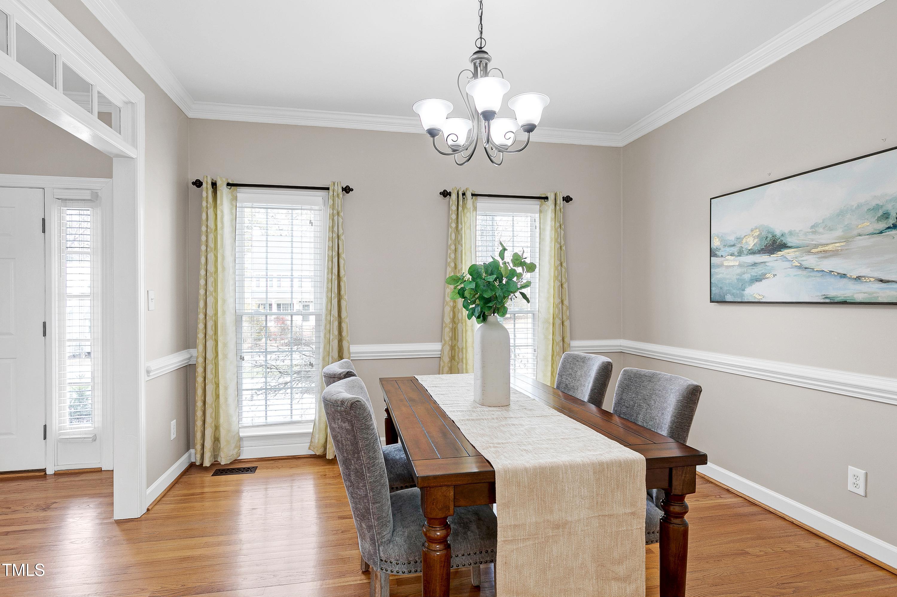 103 Sandy Hook Way Cary, NC 27513 - Photo 7 of 45 a view of a dining room with furniture window and wooden floor