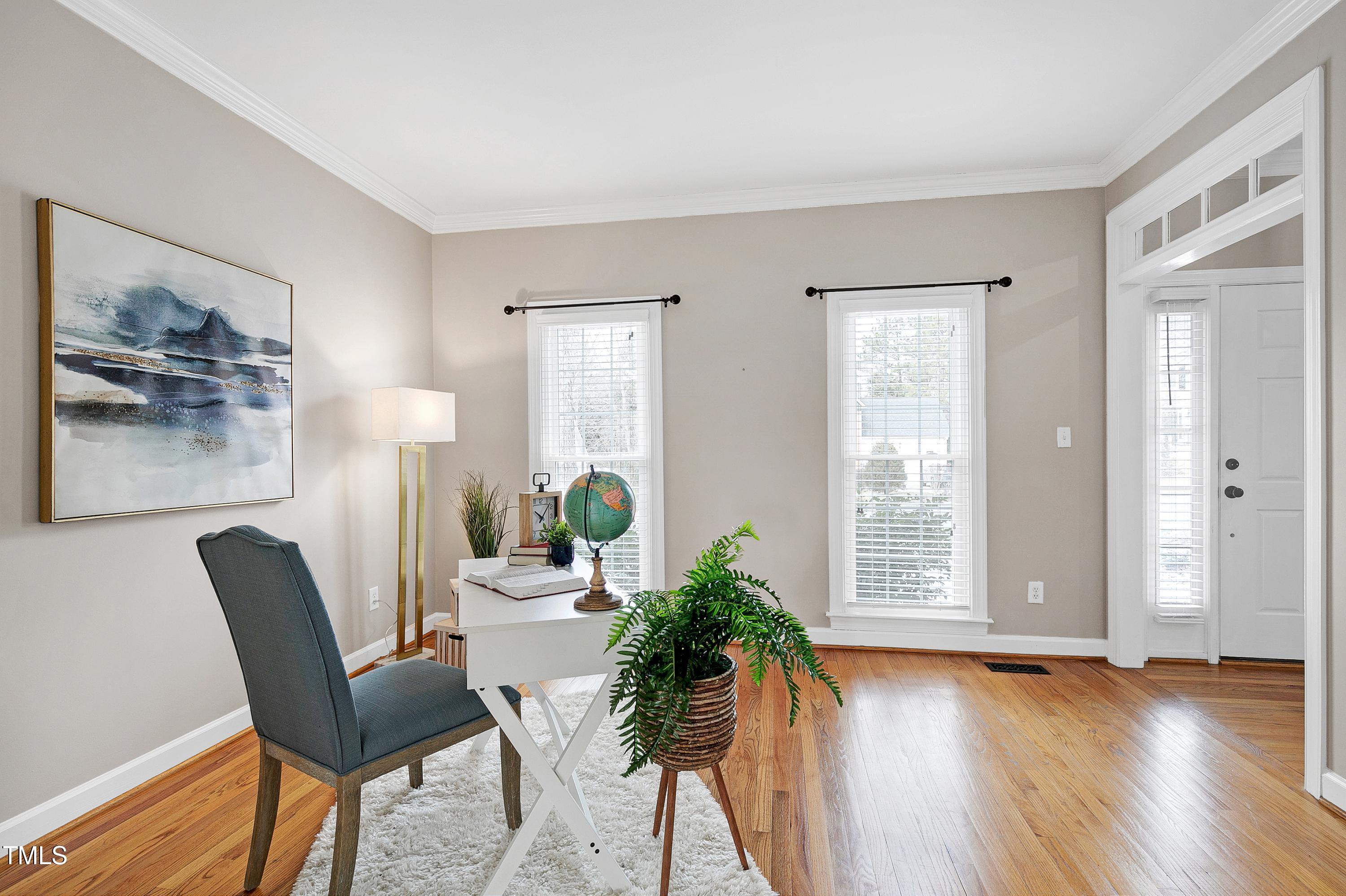 103 Sandy Hook Way Cary, NC 27513 - Photo 9 of 45 a view of a livingroom with furniture and a potted plant