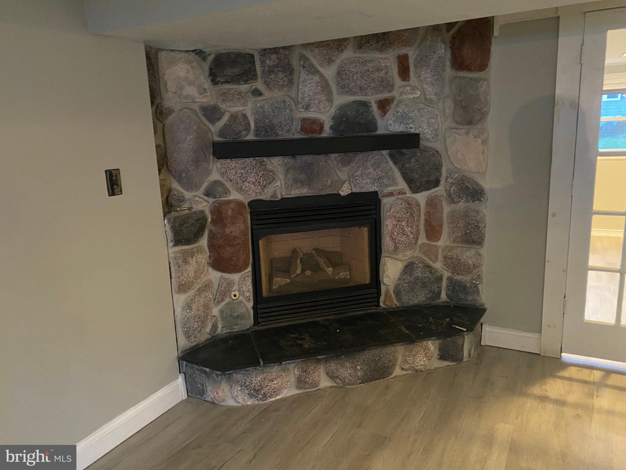 106 Parkview Road Stratford, NJ 08084 - Photo 13 of 27 Cozy stone fireplace centerpiece.