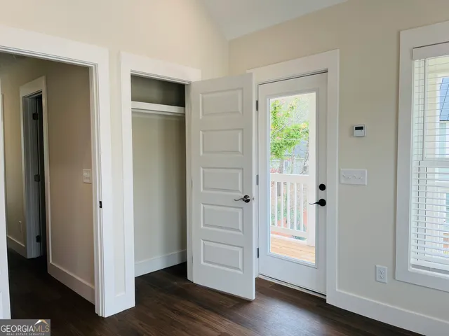 a view of a balcony with wooden floor