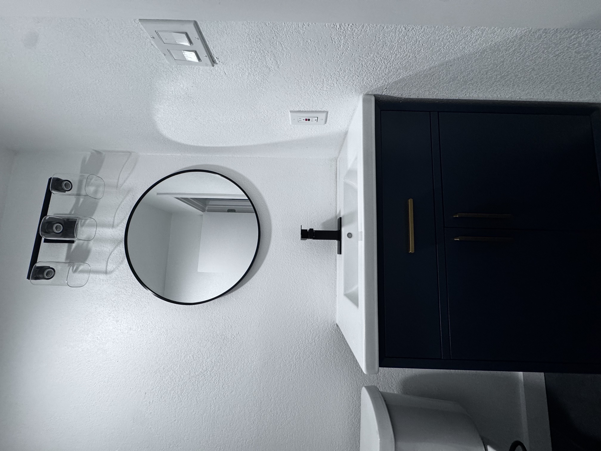 4908 Hawk Cove, Unit 2 Austin, TX 78745 - Photo 13 of 17 a bathroom with a sink mirror and toilet
