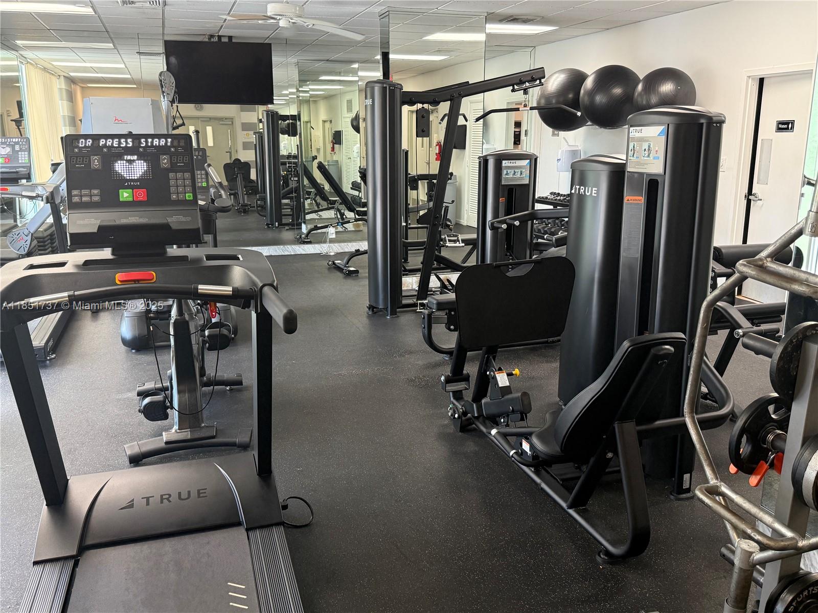 2100 Sans Souci Boulevard, Unit B1406 North Miami, FL 33181 - Photo 14 of 17 a view of a room with gym equipment