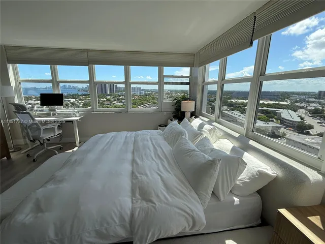 a living room with large windows