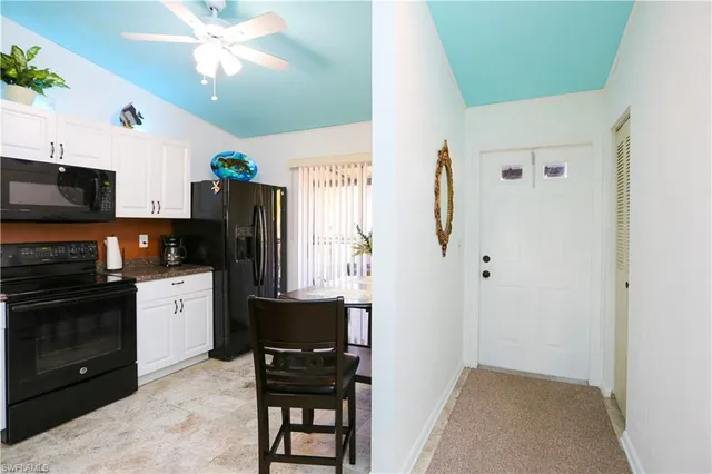 a kitchen with stainless steel appliances a stove microwave and refrigerator