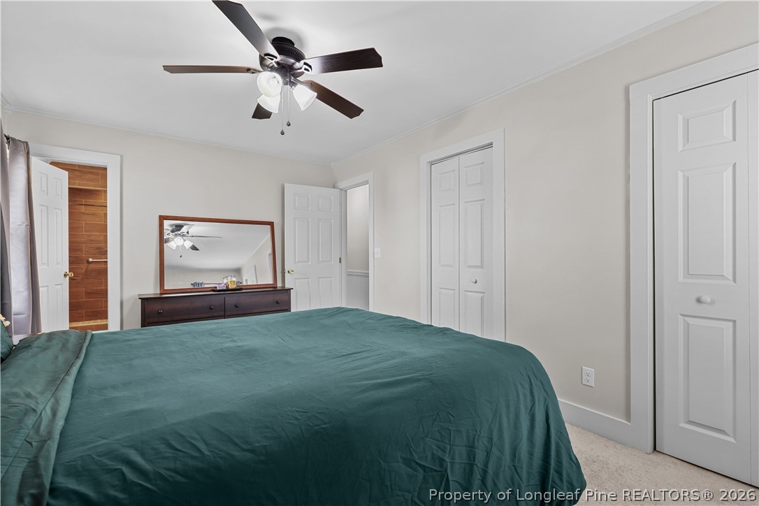 205 Violet Road Dunn, NC 28334 - Photo 15 of 31 a bedroom with a bed and window