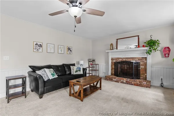 a living room with furniture and a fireplace