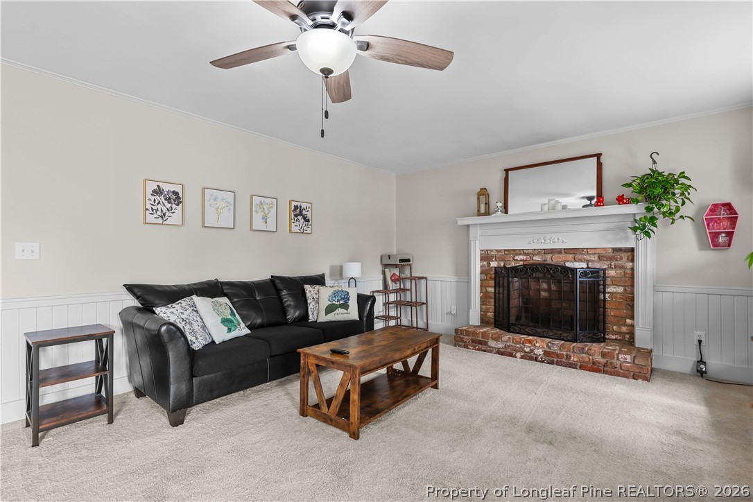 205 Violet Road Dunn, NC 28334 - Photo 2 of 31 a living room with furniture and a fireplace