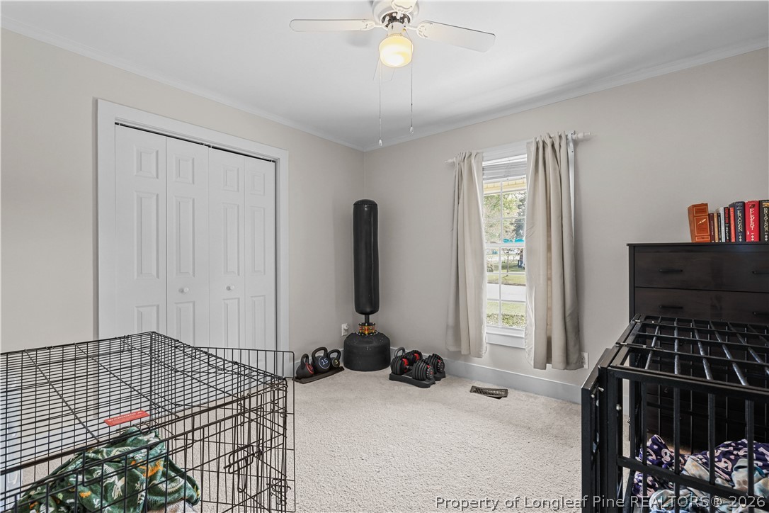 205 Violet Road Dunn, NC 28334 - Photo 21 of 31 a view of a room with gym equipment