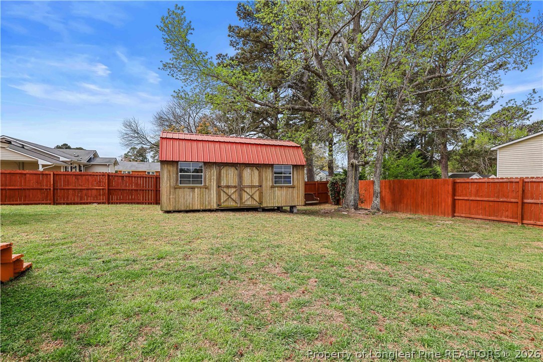 205 Violet Road Dunn, NC 28334 - Photo 26 of 31 a view of an outdoor space and yard