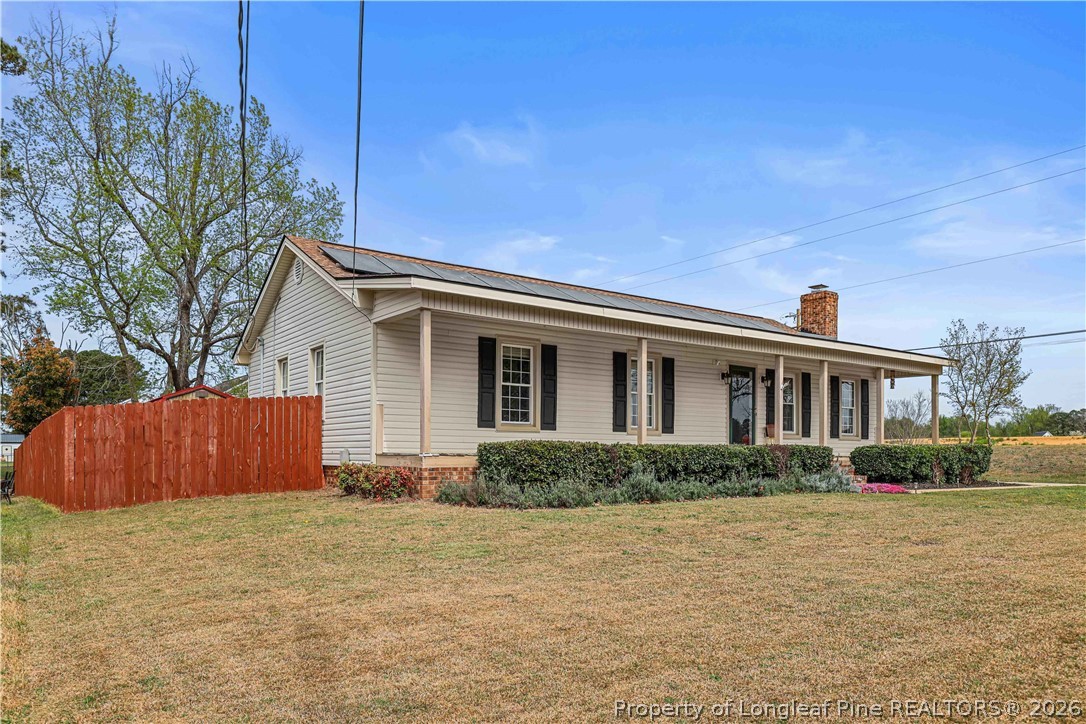 205 Violet Road Dunn, NC 28334 - Photo 30 of 31 a front view of house with yard and trees around