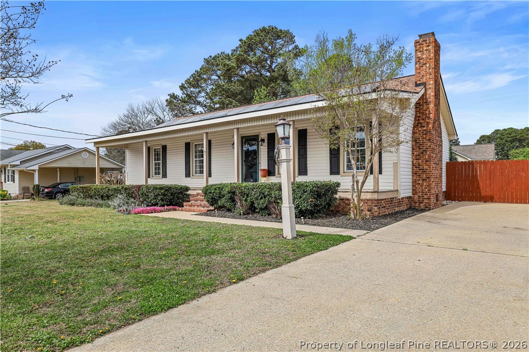 205 Violet Road Dunn, NC 28334 - Photo 31 of 31 a front view of a house with garden