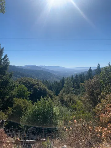a view of a city with green field