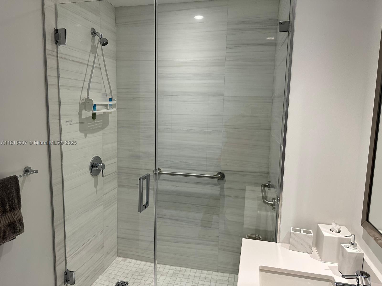 851 Northeast 1st Avenue, Unit 1108 Miami, FL 33132 - Photo 13 of 42 a bathroom with a shower