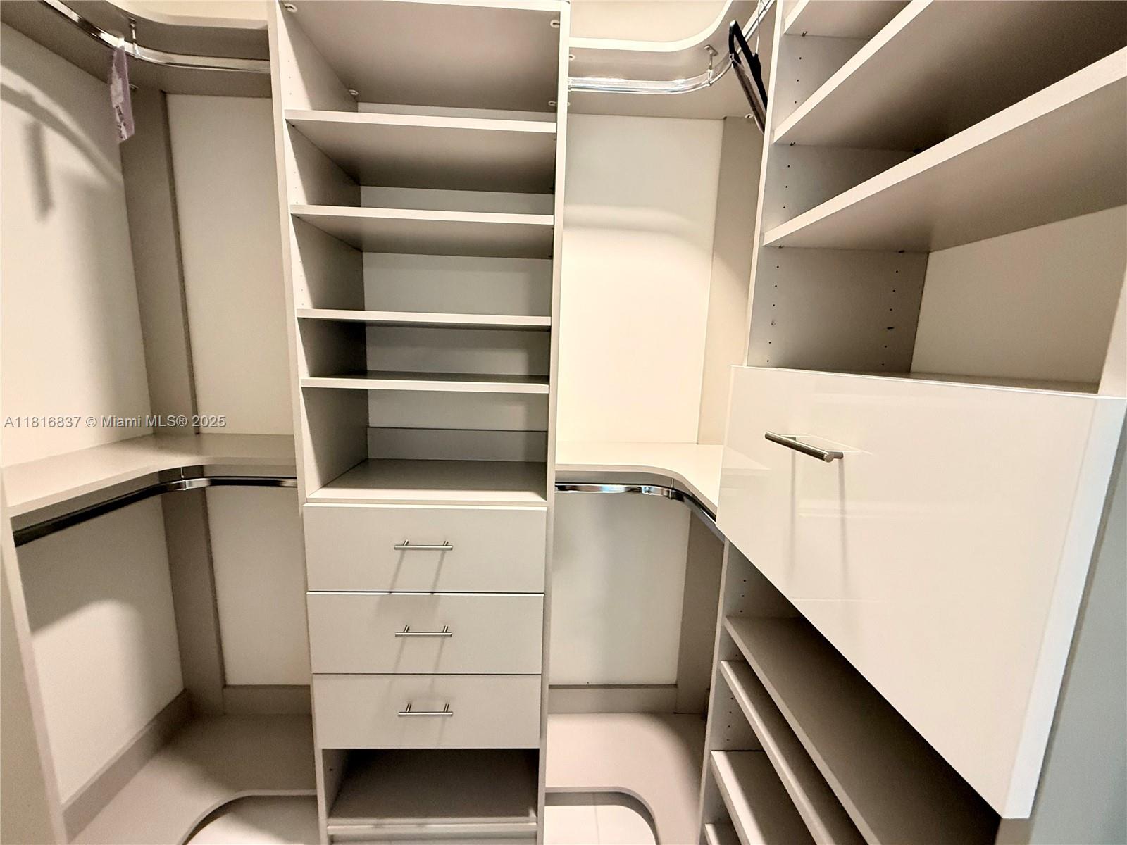 851 Northeast 1st Avenue, Unit 1108 Miami, FL 33132 - Photo 17 of 42 a view of an empty walk in closet