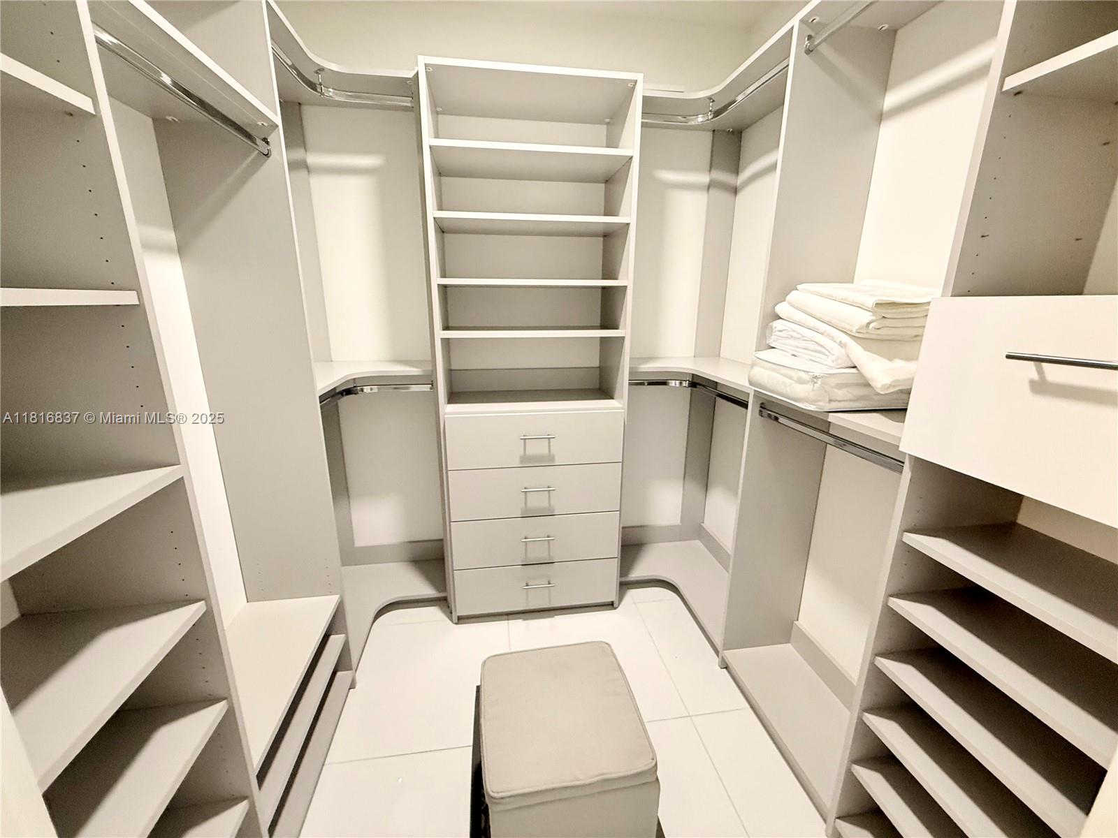 851 Northeast 1st Avenue, Unit 1108 Miami, FL 33132 - Photo 18 of 42 a view of walk in closet with empty racks