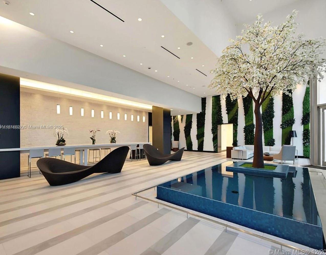 851 Northeast 1st Avenue, Unit 1108 Miami, FL 33132 - Photo 28 of 42 a living room with large window and furniture