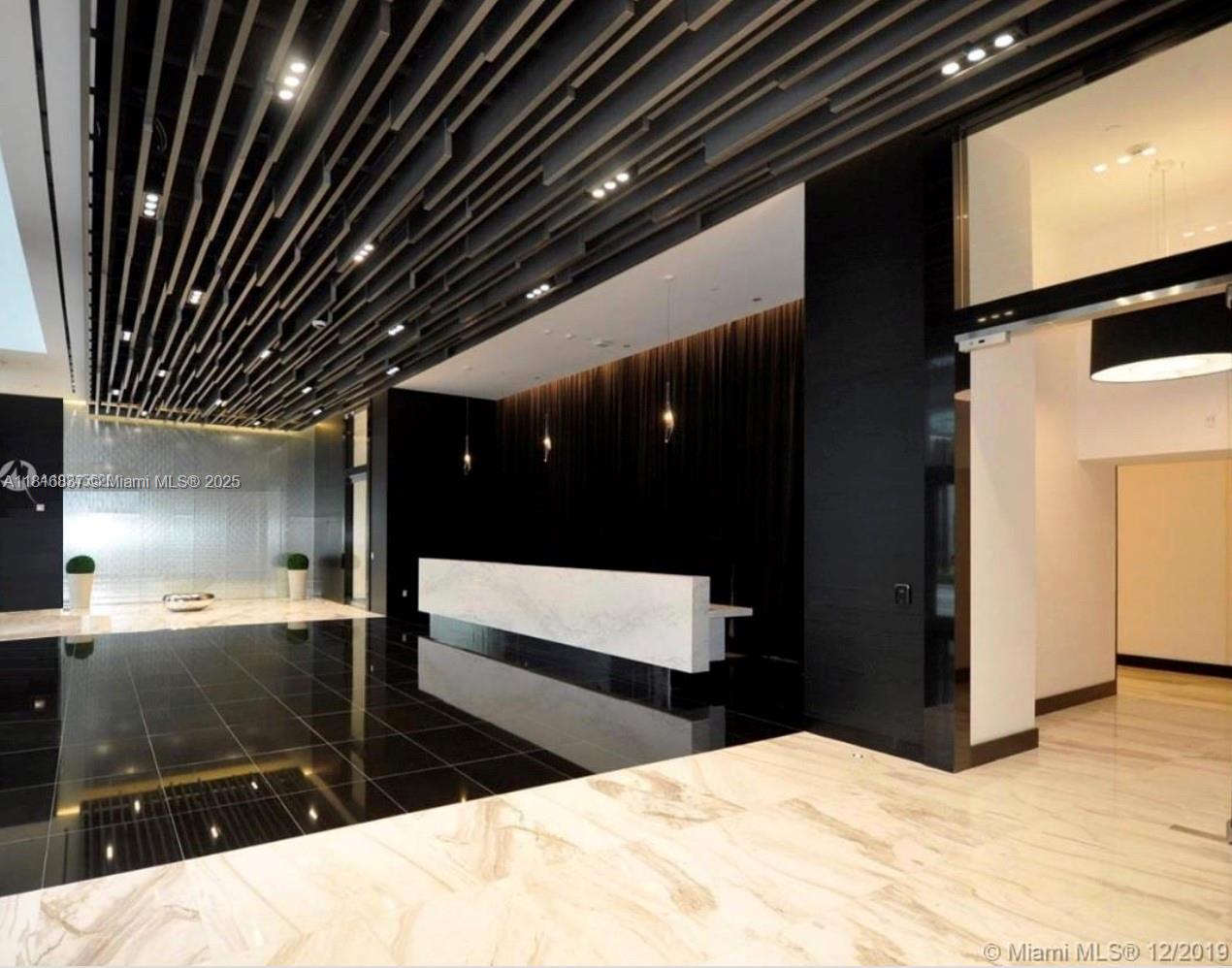 851 Northeast 1st Avenue, Unit 1108 Miami, FL 33132 - Photo 32 of 42 a bathroom with a sink and a shower