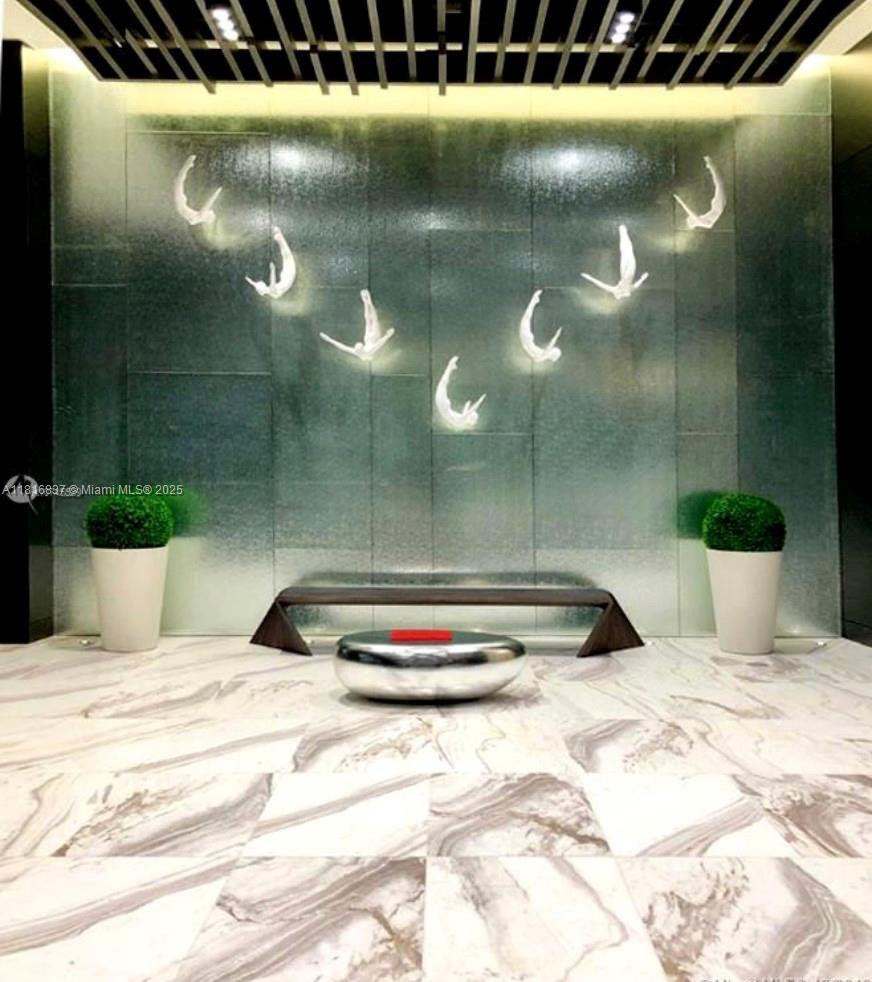 851 Northeast 1st Avenue, Unit 1108 Miami, FL 33132 - Photo 34 of 42 a bathroom with a bathtub