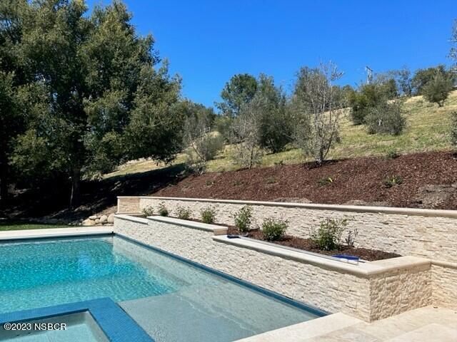 945 Old Ranch Road Solvang, CA 93463 - Photo 2 of 34 pool twds olive grove hillside
