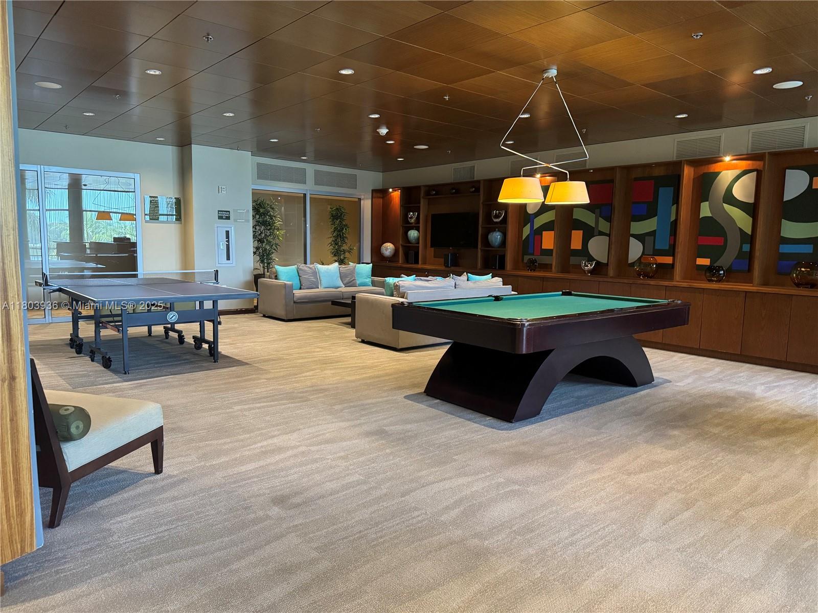 2641 North Flamingo Road, Unit 1001N Sunrise, FL 33323 - Photo 16 of 84 a view of a chairs and table in a patio