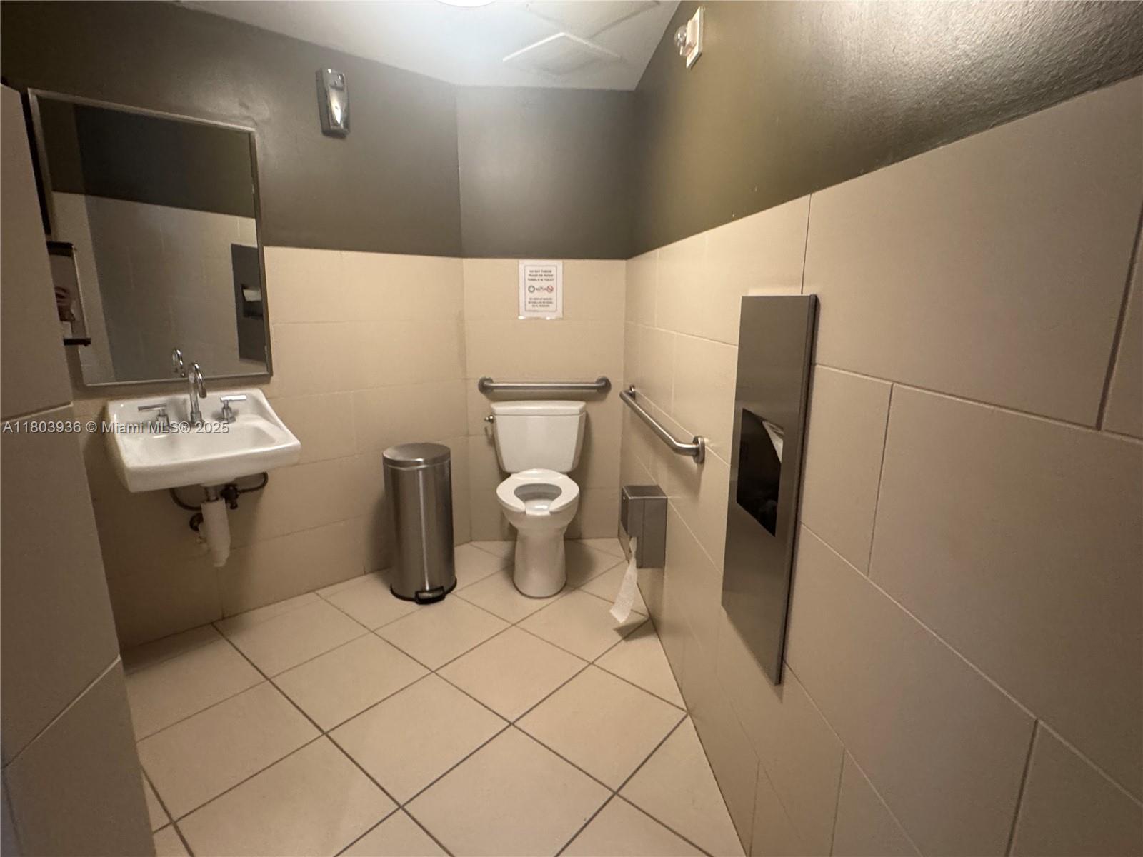 2641 North Flamingo Road, Unit 1001N Sunrise, FL 33323 - Photo 21 of 84 a bathroom with a toilet and a mirror