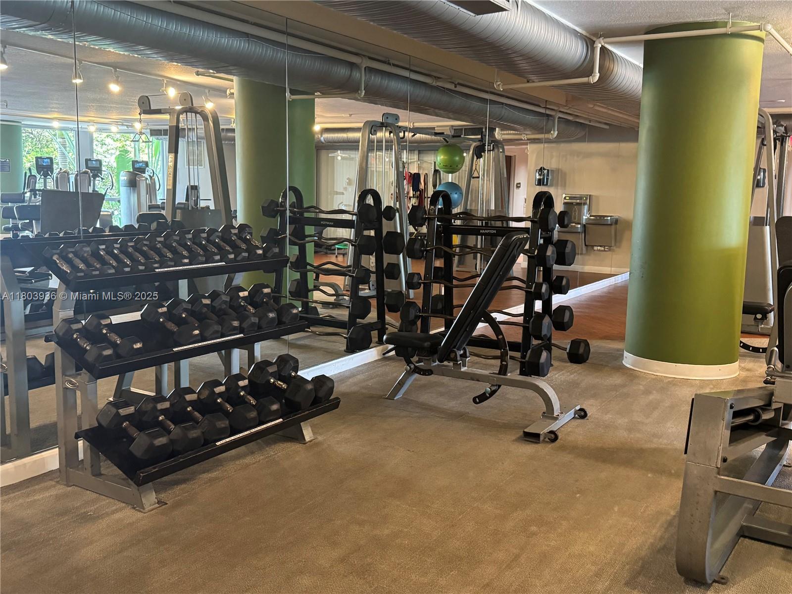 2641 North Flamingo Road, Unit 1001N Sunrise, FL 33323 - Photo 23 of 84 a room with gym equipment and large mirror