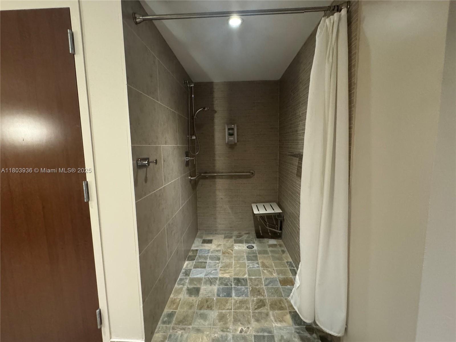 2641 North Flamingo Road, Unit 1001N Sunrise, FL 33323 - Photo 27 of 84 a bathroom with a glass shower door