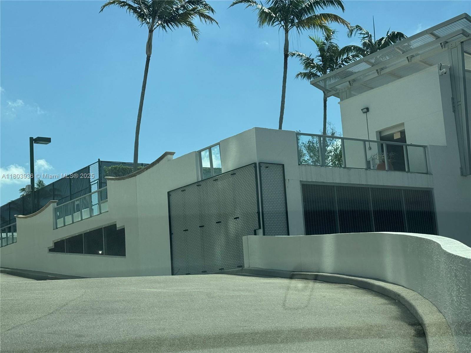 2641 North Flamingo Road, Unit 1001N Sunrise, FL 33323 - Photo 3 of 84 a front view of a house with a garden