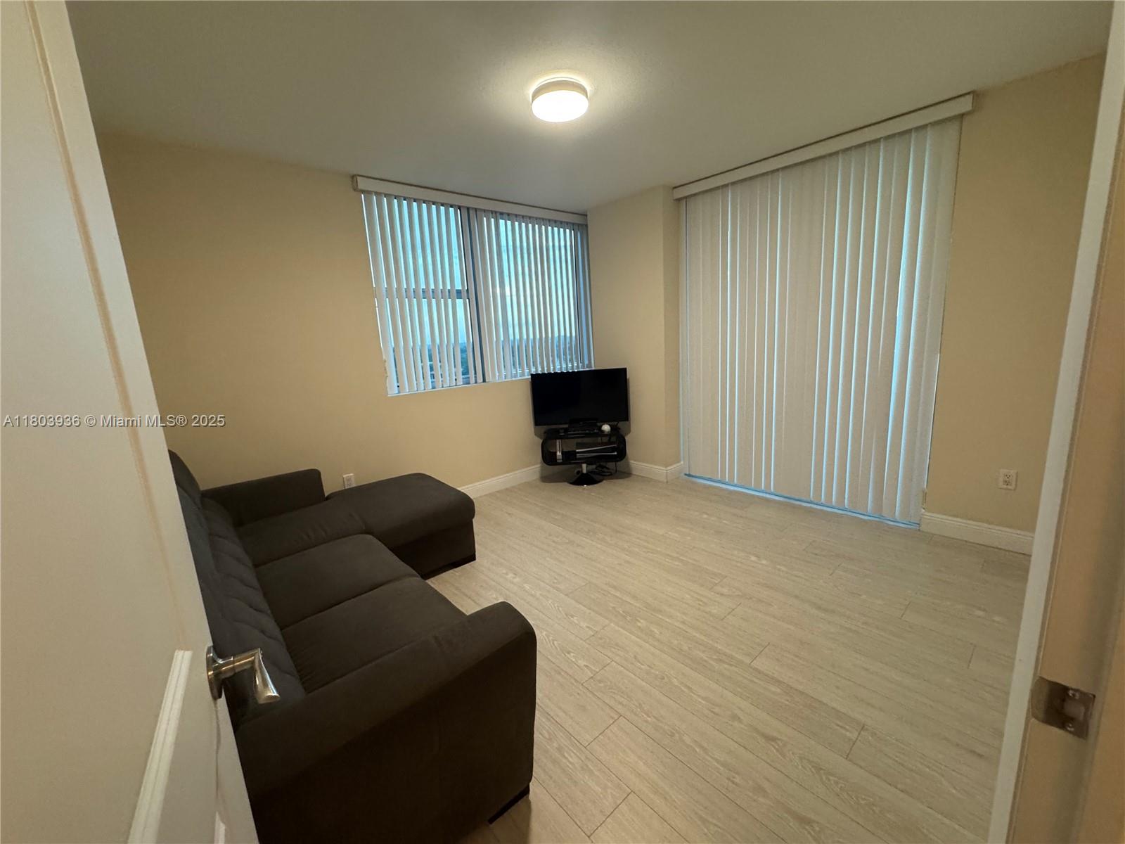 2641 North Flamingo Road, Unit 1001N Sunrise, FL 33323 - Photo 49 of 84 a living room with furniture and a window