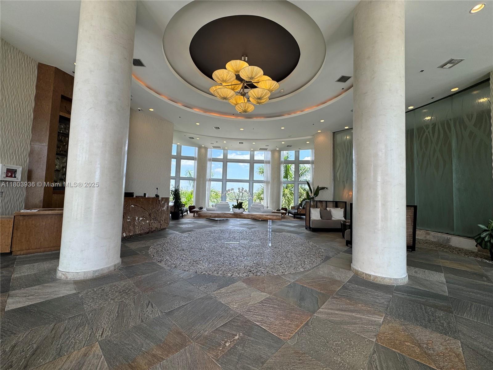 2641 North Flamingo Road, Unit 1001N Sunrise, FL 33323 - Photo 6 of 84 a view of a livingroom with furniture and a large window