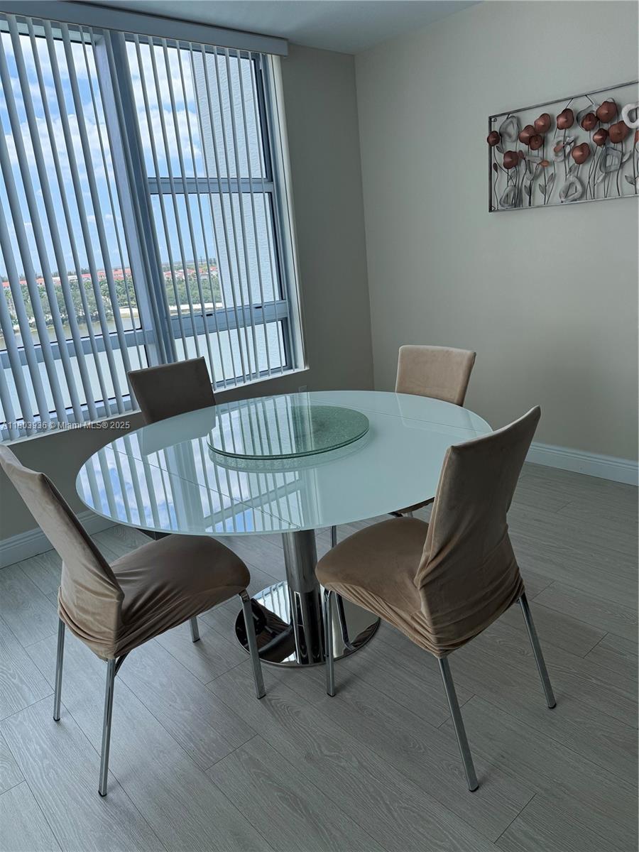 2641 North Flamingo Road, Unit 1001N Sunrise, FL 33323 - Photo 63 of 84 a view of a workspace with furniture window and wooden floor