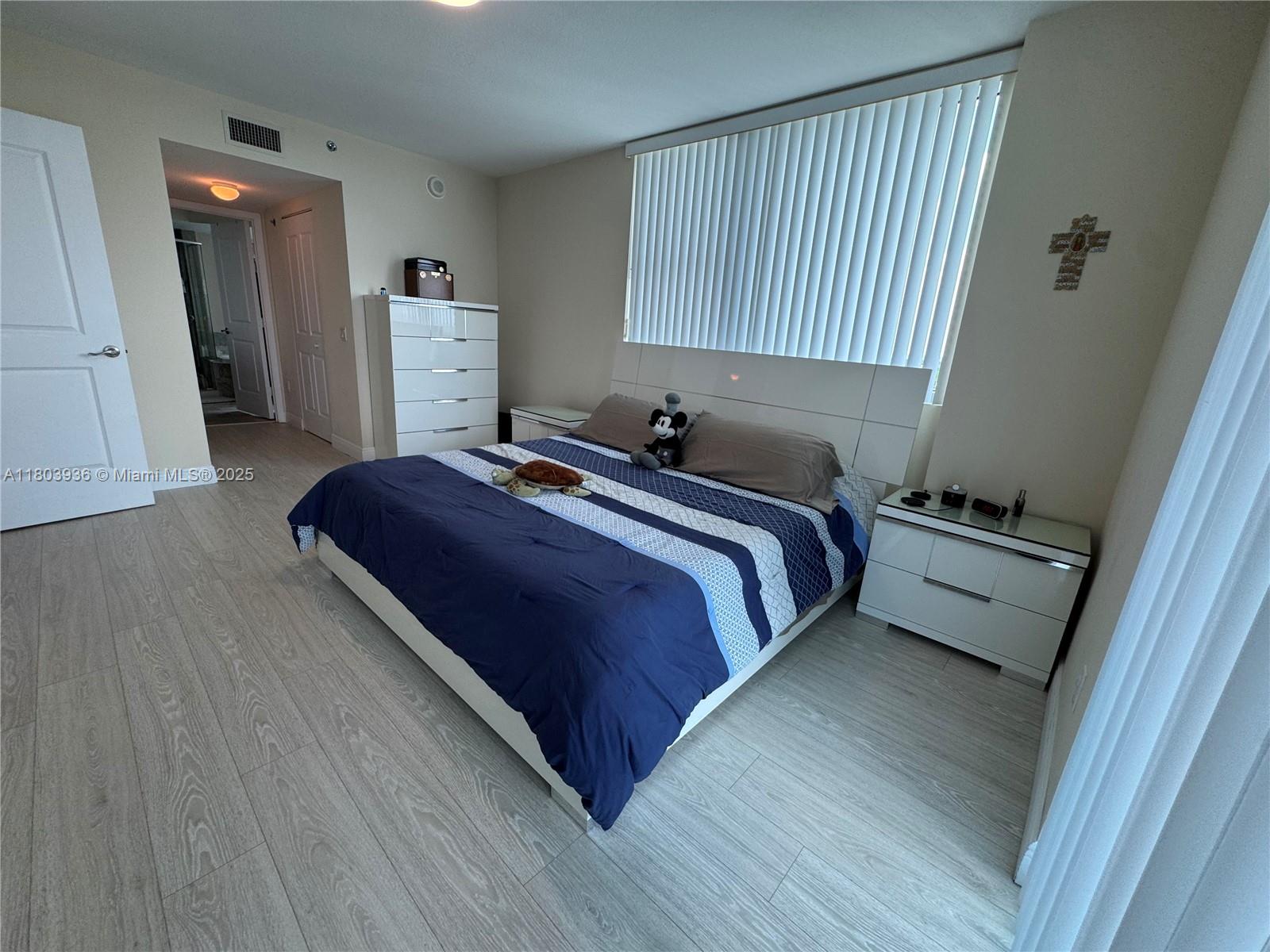 2641 North Flamingo Road, Unit 1001N Sunrise, FL 33323 - Photo 70 of 84 a bedroom with a bed and a window