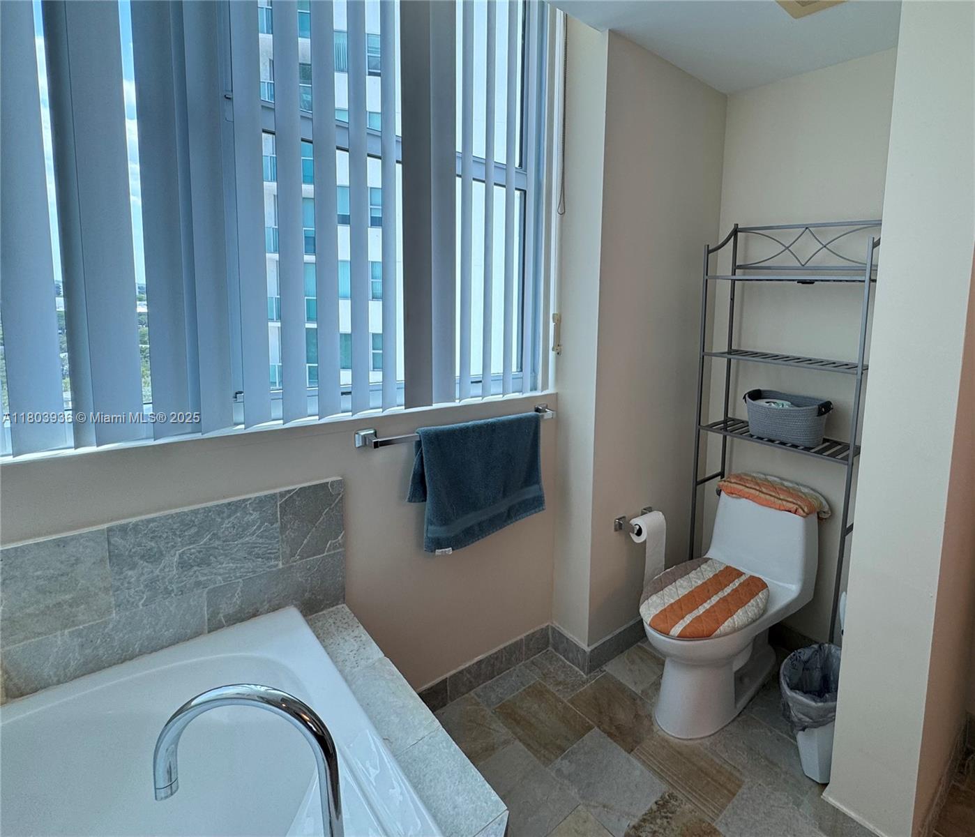2641 North Flamingo Road, Unit 1001N Sunrise, FL 33323 - Photo 74 of 84 a white toilet sitting next to a bathroom sink