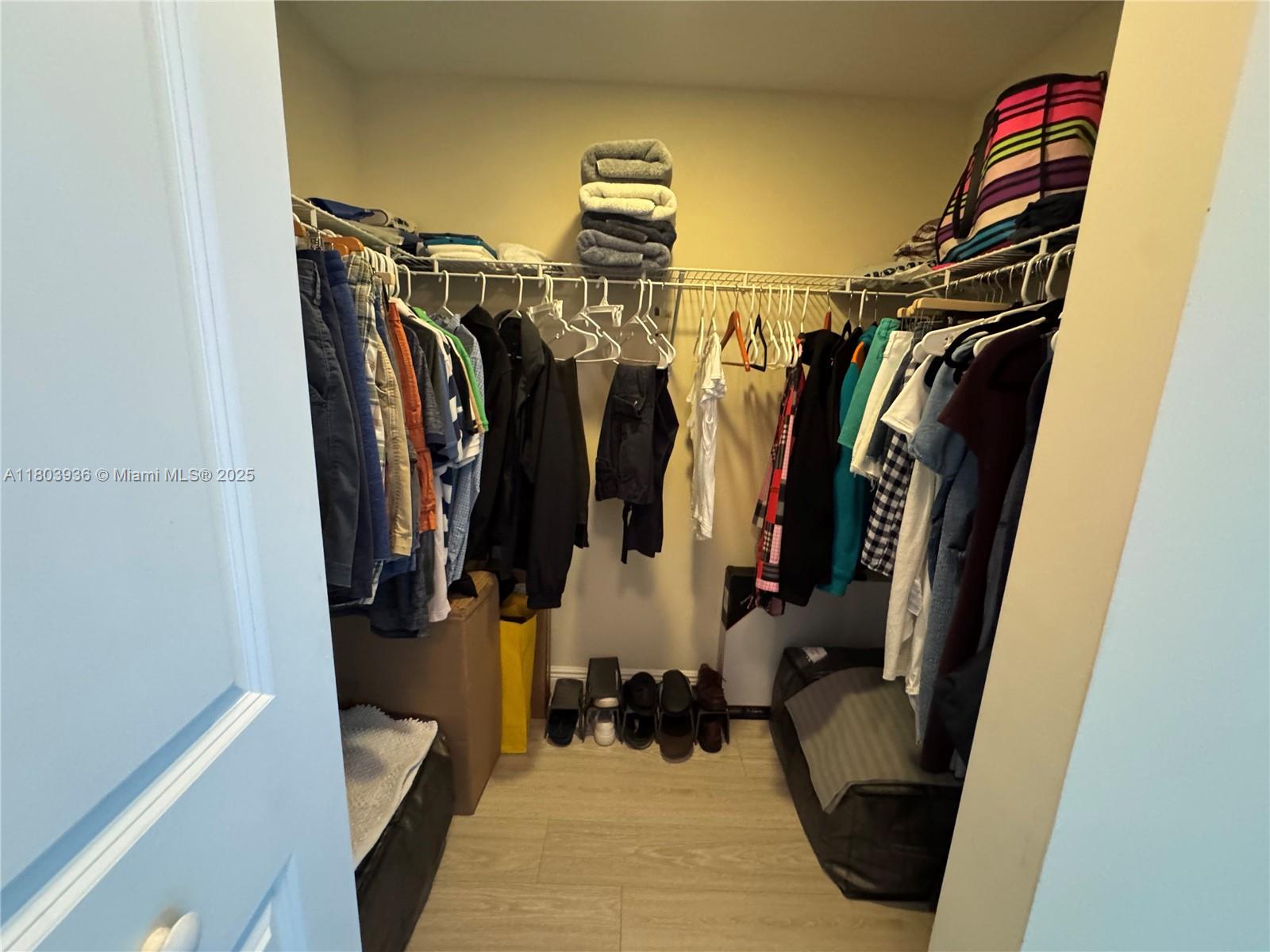 2641 North Flamingo Road, Unit 1001N Sunrise, FL 33323 - Photo 76 of 84 a view of walk in closet with clothes and shoes
