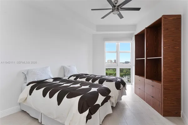 a bedroom with a bed and window