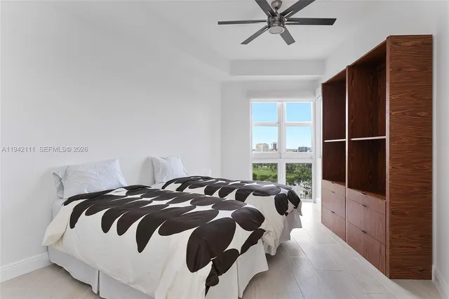 a bedroom with a bed and window