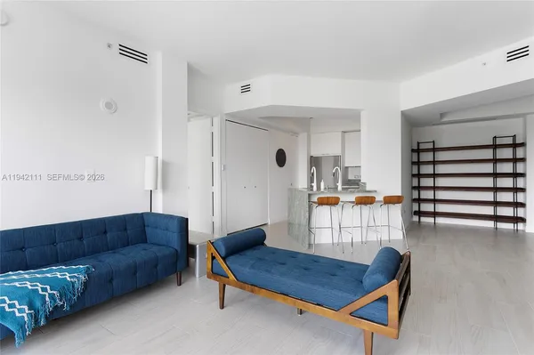 a living room with furniture and a table