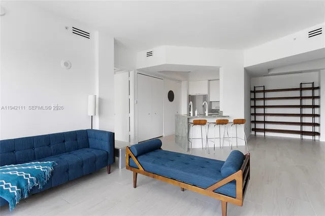 a living room with furniture and a table