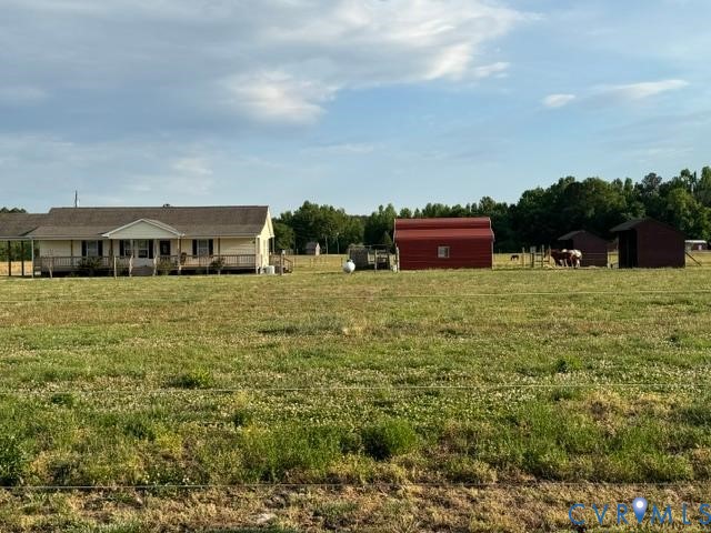 19886 River Road Courtland, VA 23837 - Photo 19 of 29 a view of a big yard with an outdoor seating