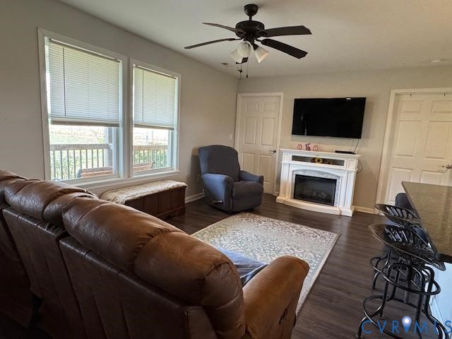 19886 River Road Courtland, VA 23837 - Photo 4 of 29 a living room with furniture a flat screen tv and a fireplace