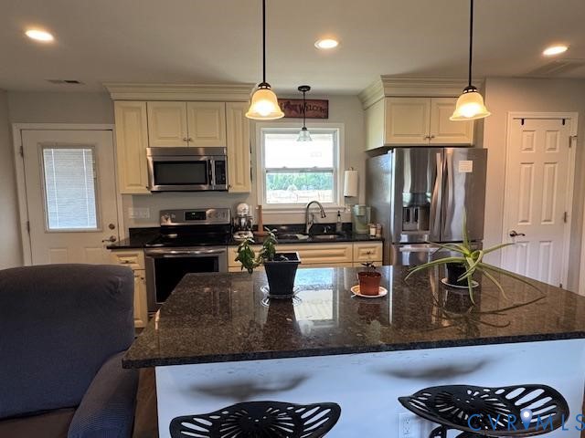 19886 River Road Courtland, VA 23837 - Photo 6 of 29 a kitchen with a refrigerator a stove and a sink with wooden floor