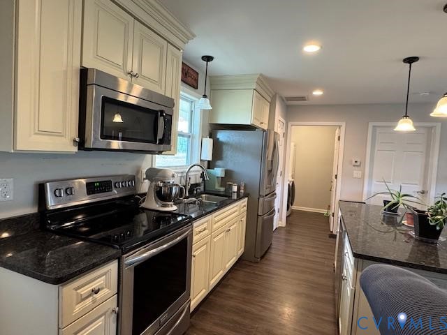 19886 River Road Courtland, VA 23837 - Photo 7 of 29 a kitchen with stainless steel appliances granite countertop a stove refrigerator and microwave