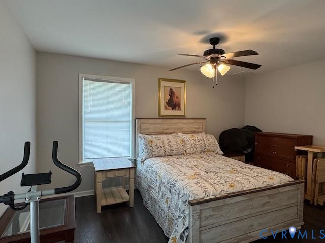 19886 River Road Courtland, VA 23837 - Photo 9 of 29 a bedroom with a bed and a chandelier