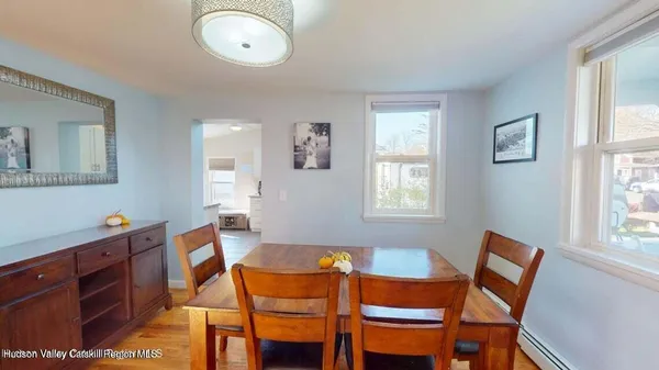 a dining room with furniture and window