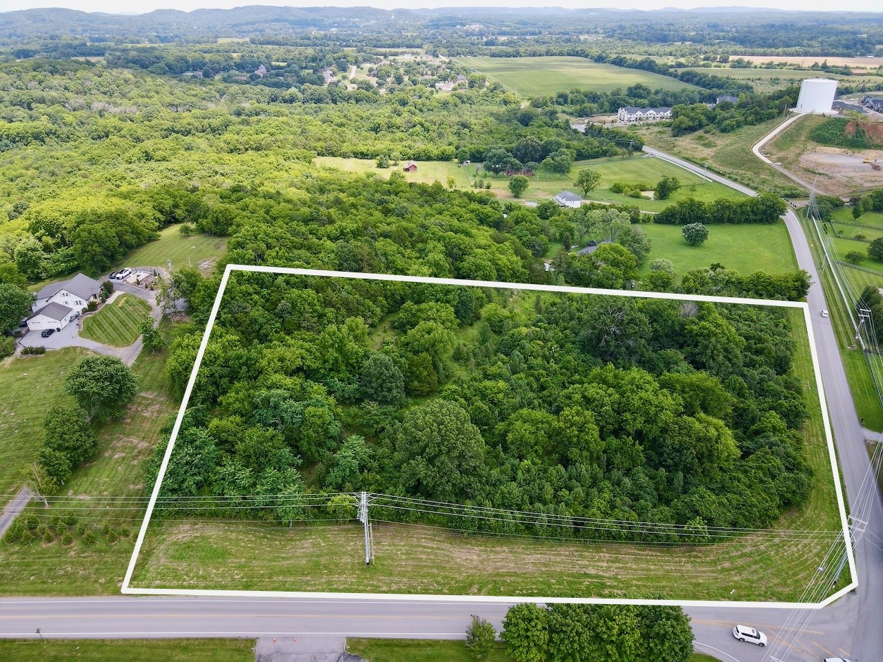 0 Thompson's Station Road East Thompson's Station, TN 37179 - Photo 1 of 15 an aerial view of a houses with a yard