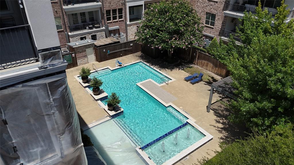 5015 Meridian Lane, Unit 2102 Addison, TX 75001 - Photo 31 of 36 Community swimming pool featuring a multi-level design and integrated water features
